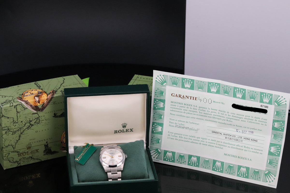 Rolex Oyster Perpetual Complete 26mm Steel Case White Dial Smooth Bezel Oyster Bracelet 67180