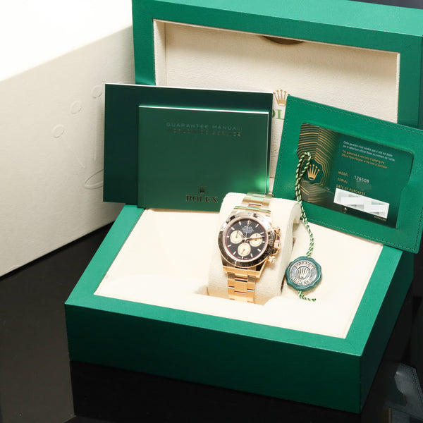 Rolex Daytona 2024 Complete 40mm 18K Yellow Gold Intense Black with Champagne Chronograph Counters Dial  Fixed 18K Yellow Gold Tachymeter Bezel 18K Yellow Gold Oyster Bracelet  126508
