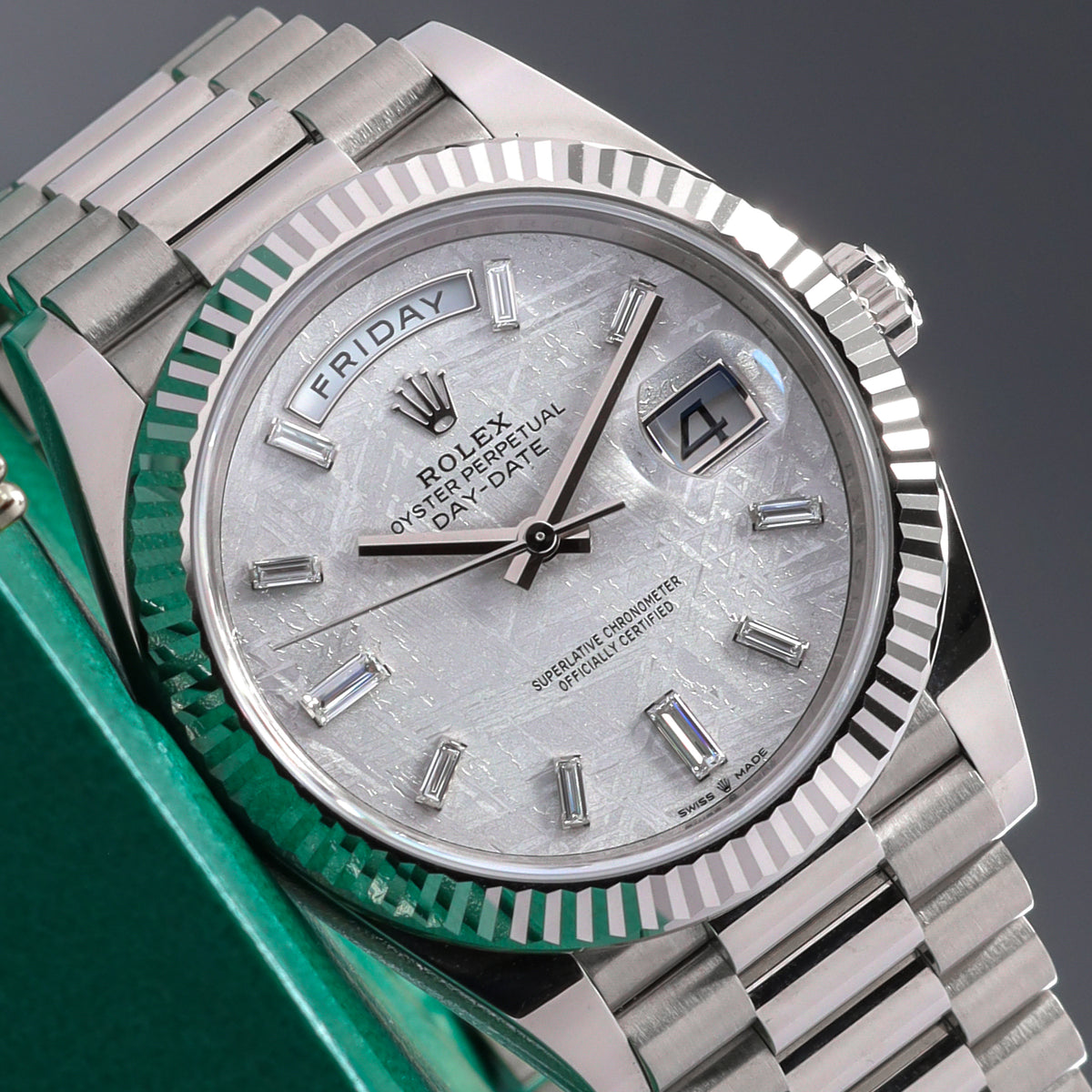 Rolex Day Date 2024 Complete 40mm 18k White Gold Meteorite with Baguette-Cut Diamond Markers Dial 18k White Gold Fluted Bezel 18k White Gold President Bracelet with Concealed Crownclasp 228239