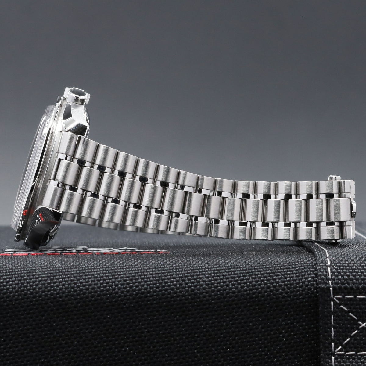 Omega Speedmaster 2026 42mm Stainless Steel  White Lacquered Dial with Black Accents Fixed Black Anodized Aluminum Tachymeter Bezel  Stainless Steel Five-Link Bracelet with Foldover Clasp 310.30.42.50.04.001