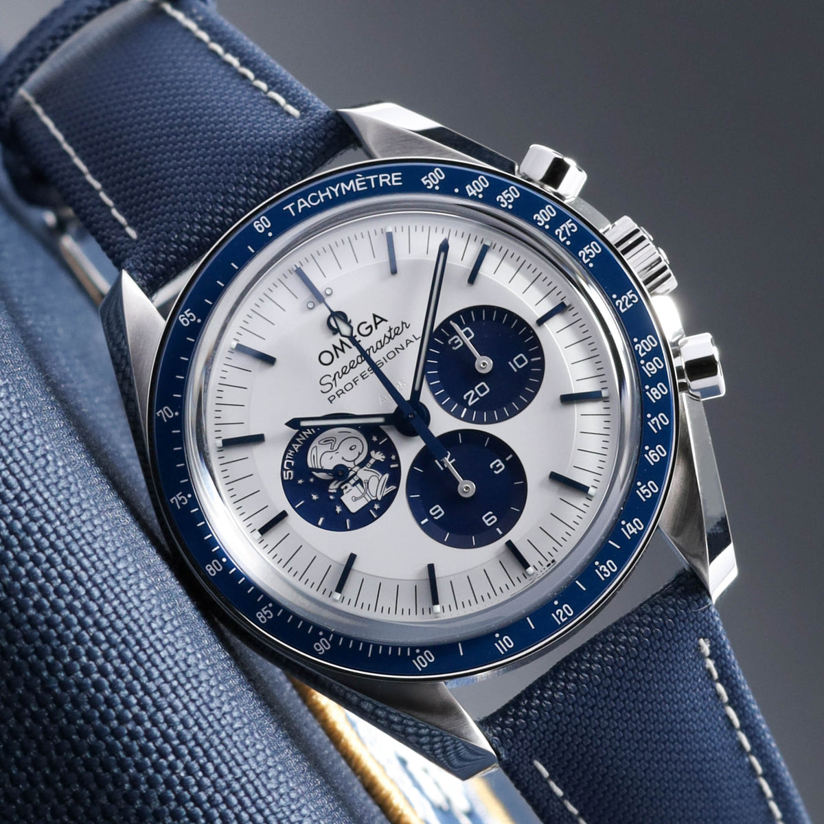 Omega Speedmaster 2026 Complete 42mm Stainless Steel Silver with Snoopy Subdial Blue Ceramic Bezel Blue Nylon Fabric Strap 310.32.42.50.02.001