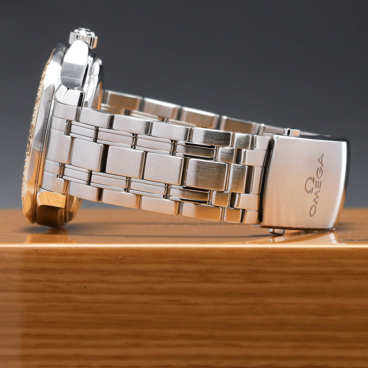 Omega Seamaster Paris 2024 Complete 42mm Stainless Steel and 18k Moonshine Gold White Ceramic Dial 18k Moonshine Gold Unidirectional Bezel Stainless Steel Bracelet 522.21.42.20.04.001