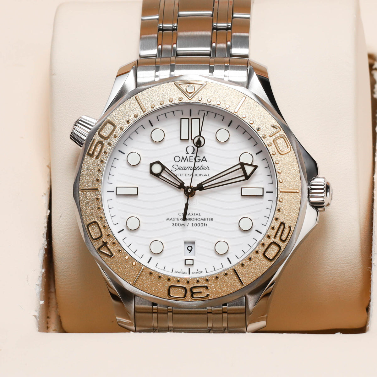 Omega Seamaster Paris 2024 Complete 42mm Stainless Steel and 18k Moonshine Gold White Ceramic Dial 18k Moonshine Gold Unidirectional Bezel Stainless Steel Bracelet 522.21.42.20.04.001