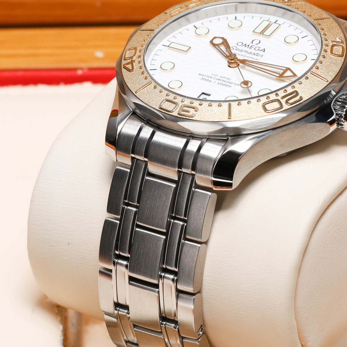 Omega Seamaster Paris 2024 Complete 42mm Stainless Steel and 18k Moonshine Gold White Ceramic Dial 18k Moonshine Gold Unidirectional Bezel Stainless Steel Bracelet 522.21.42.20.04.001