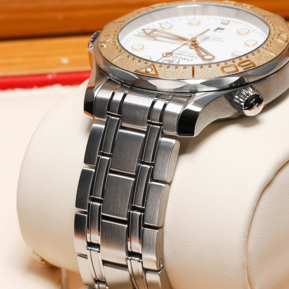 Omega Seamaster Paris 2024 Complete 42mm Stainless Steel and 18k Moonshine Gold White Ceramic Dial 18k Moonshine Gold Unidirectional Bezel Stainless Steel Bracelet 522.21.42.20.04.001