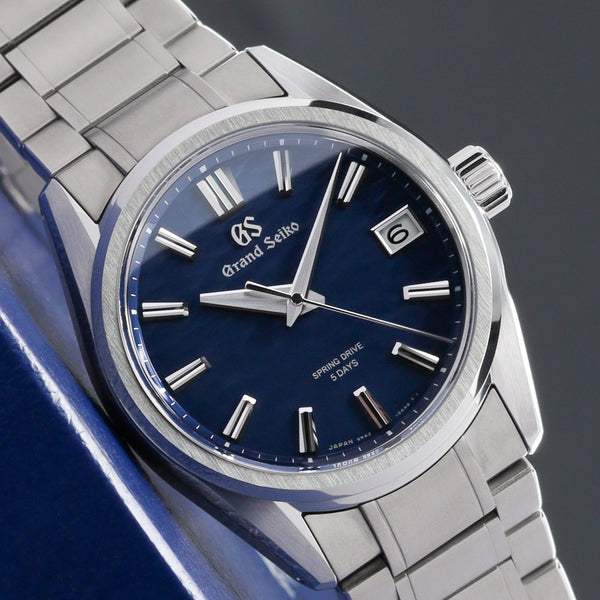 Grand Seiko Evolution 9 Collection 2026 Complete 40mm High Intensity Titanium Blue Lake Suwa Textured Dial High Intensity Titanium Fixed Bezel High-Intensity Titanium Bracelet with Folding Clasp SLGA019G