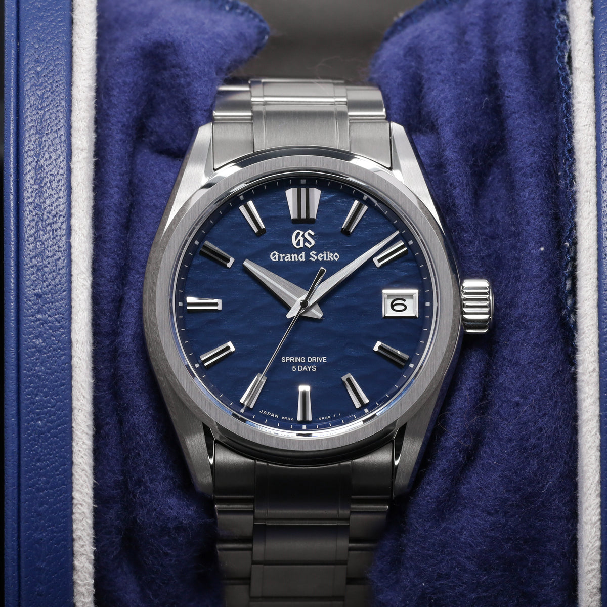 Grand Seiko Evolution 9 Collection 2026 Complete 40mm High Intensity Titanium Blue Lake Suwa Textured Dial High Intensity Titanium Fixed Bezel High-Intensity Titanium Bracelet with Folding Clasp SLGA019G